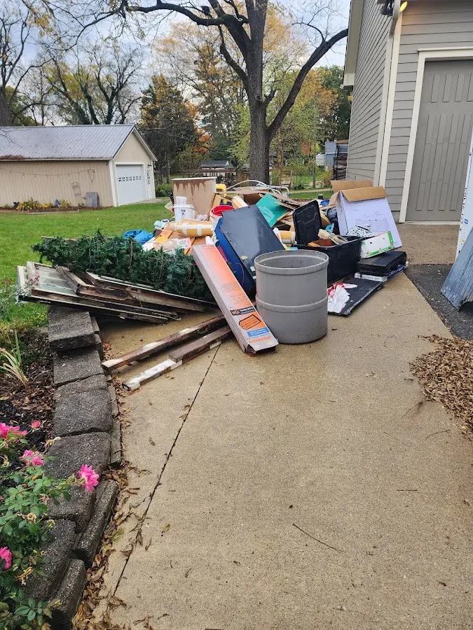 Dumpster being loaded with debris for 30 Yard Dumpster Rental in La Homa